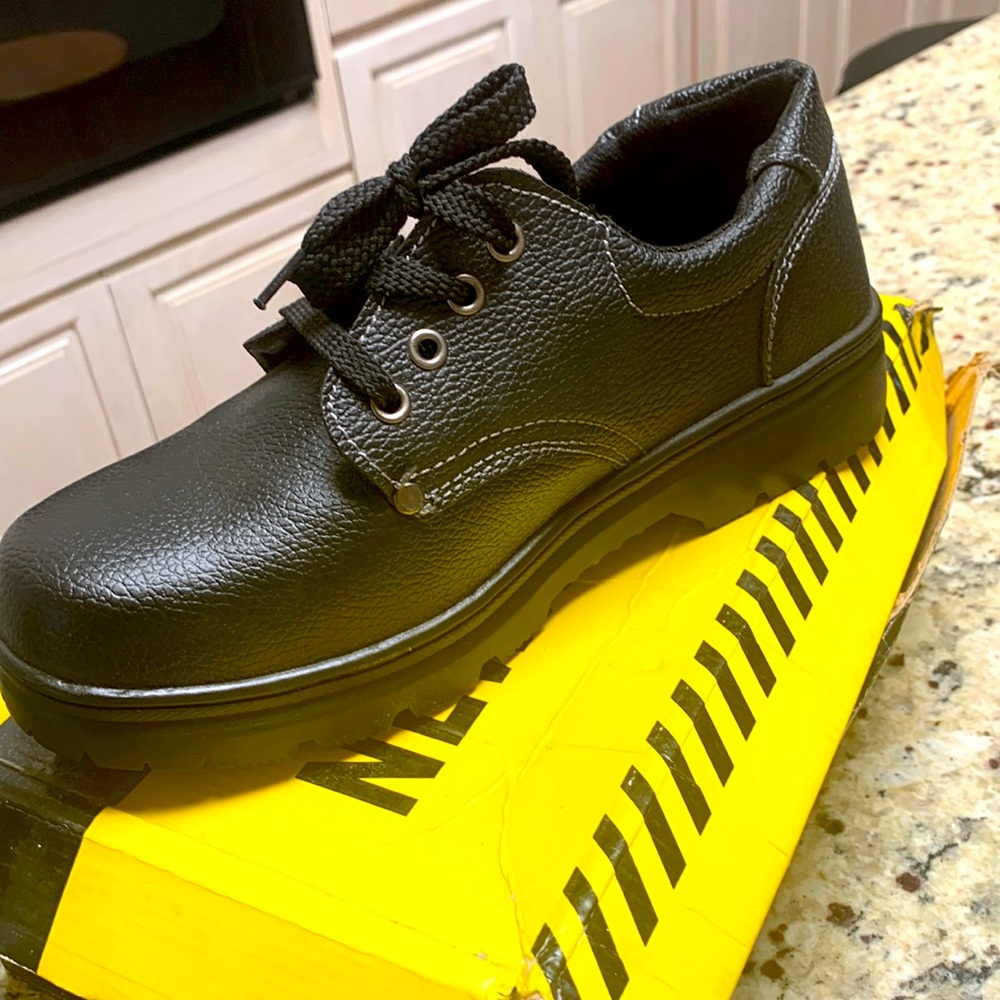 Men work shoes with steel toe, faux leather material. New